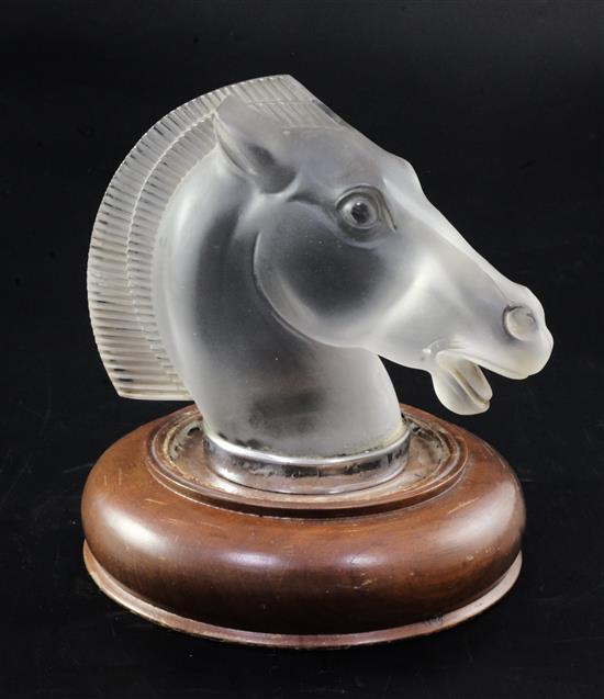 Longchamp/Horse. A glass mascot by René Lalique, introduced on 12/6/1929, No.1152A Height 12cm, overall 15cm.